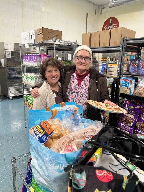 Julie Burnell Pantry Mgr. and a very happy shopper!