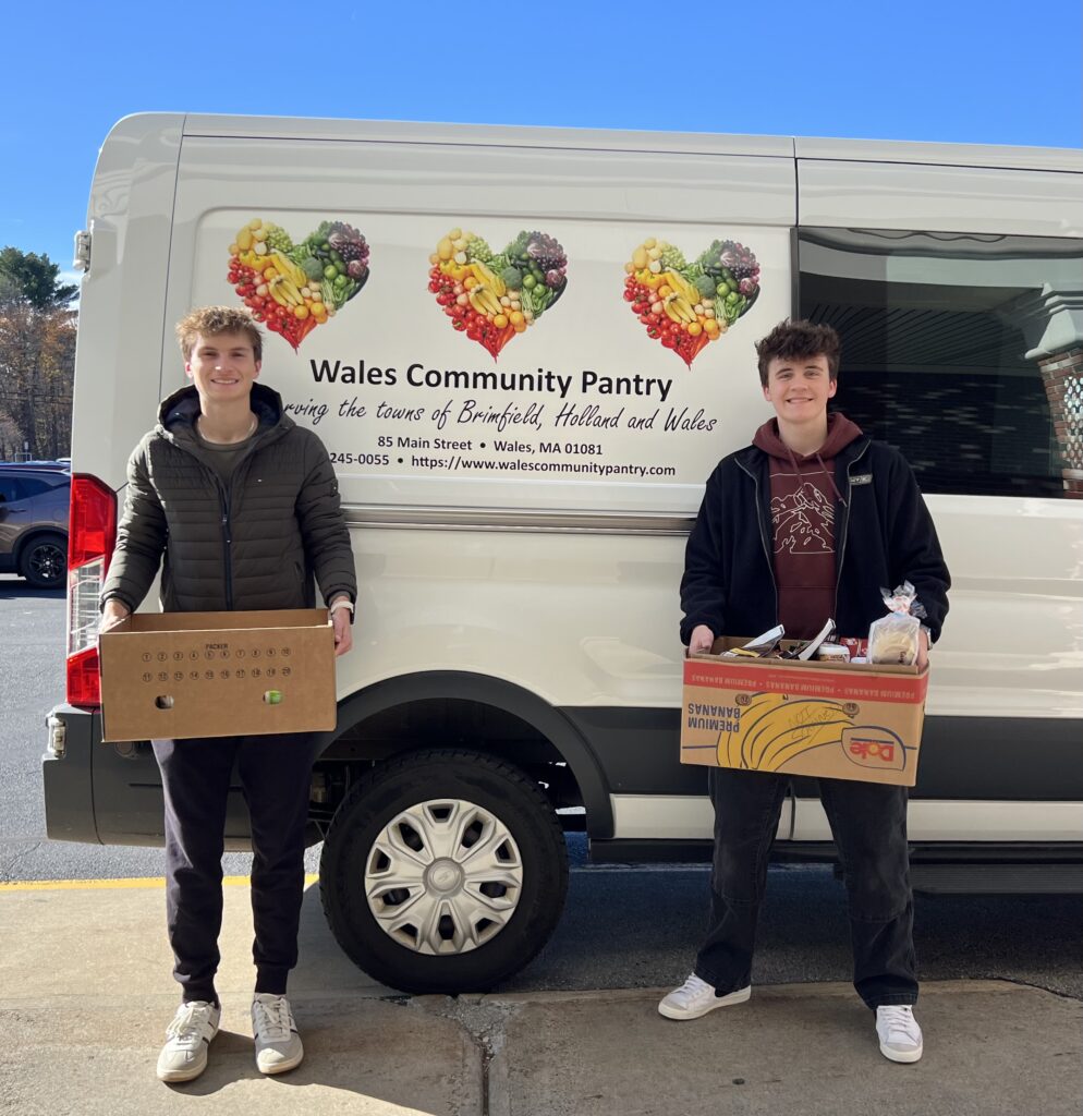 Student volunteers at local grocery store picking up donations.